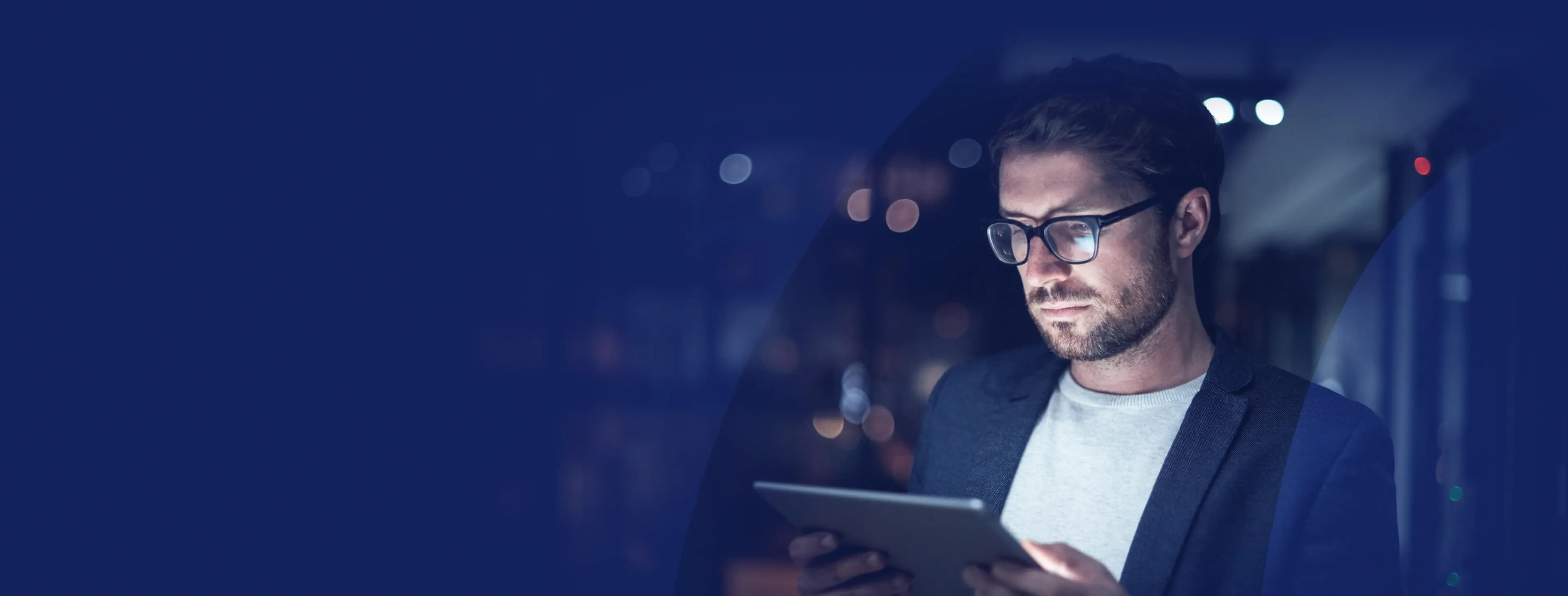 Trader looking at bloxfx app on a tablet